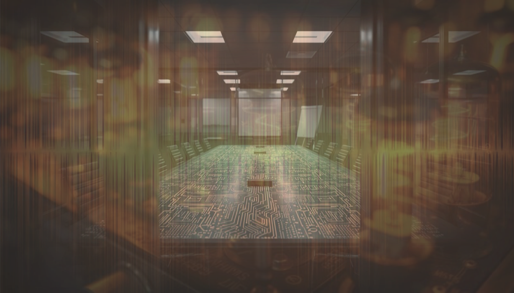A conference room with a warm amber glow, seen through glass doors